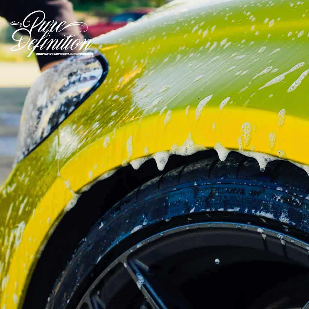 soap dripping down wheel arch of yellow c63 amg