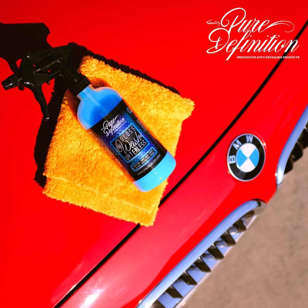 gloss wash waterless bottle and cloth on a red bmw bonnet