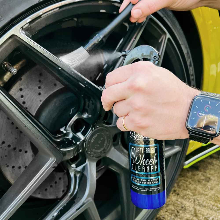 cleaning an alloy wheel with a brush and Opti-bright wheel cleaner